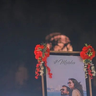 A personalized welcome board featuring the couple's photo and their wedding hashtag. It's a small detail that makes the celebration feel uniquely theirs from the very beginning.