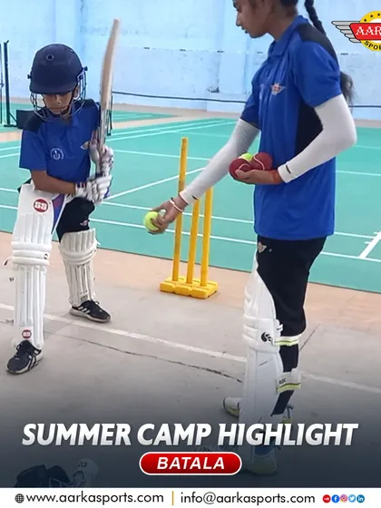 A coach gives one-on-one instruction to a beginner at our Batala summer camp. We ensure every child gets the guidance they need.