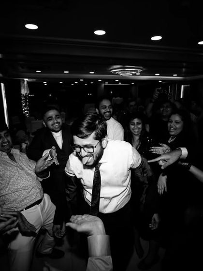 More black and white candid shots from the dance floor, capturing the wild and happy energy of the party.