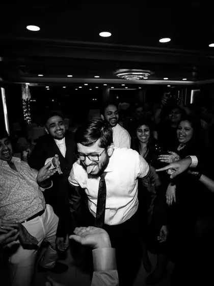 More black and white candid shots from the dance floor, capturing the wild and happy energy of the party.