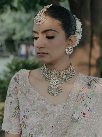 A close-up of a bride's elegant floral updo.