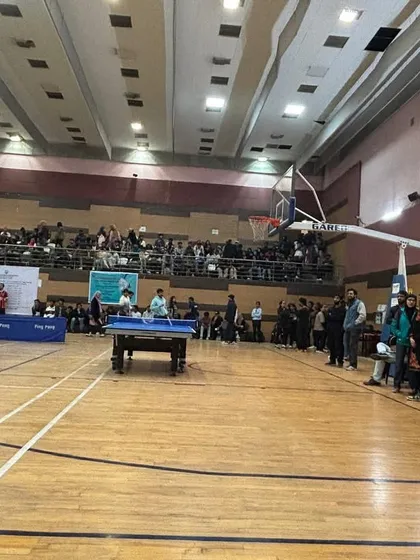 Our indoor stadium is always buzzing with activity. This view captures the excitement of an inter-faculty table tennis tournament, with spectators cheering on the players.