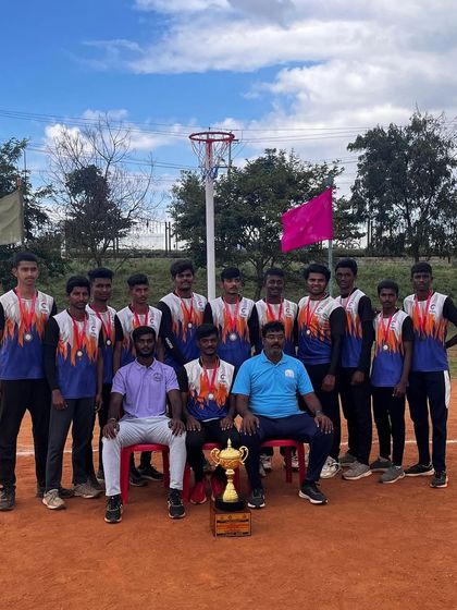 Our junior boys' netball team and coaches with their 2nd runner-up trophy. Every tournament is a learning experience.