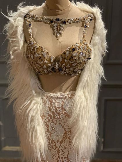 A closer look at our new ivory lace and embellished bustier set. It's a high-fashion, celebrity-style look that you can now rent.