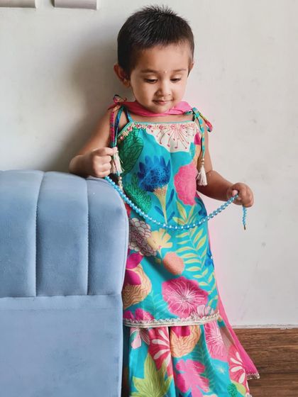 For Raksha Bandhan, I dressed my daughter in this beautiful ethnic outfit from Babyhug, available on Firstcry. The vibrant colors and design are perfect for festive celebrations.