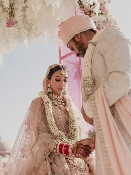 A beautiful, intimate moment during the wedding ceremony as the couple exchanges vows.