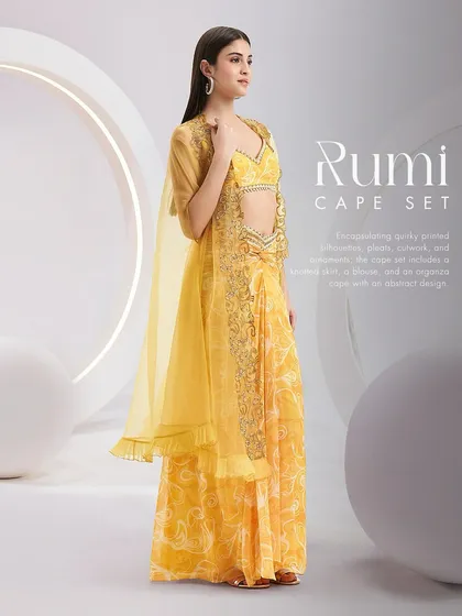 The RUMI Cape Set, encapsulating quirky printed silhouettes, pleats, cutwork, and ornaments for a look of transferable elegance.