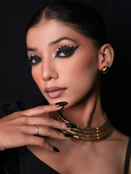 A great fashion shoot is a team effort, and makeup is key. This close-up highlights the intricate details of an Egyptian-inspired glam look, showing my skill in capturing beauty and editorial makeup artistry.