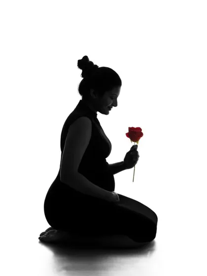 A timeless silhouette portrait that beautifully sculpts the form of motherhood. This artistic shot focuses on shape and emotion, creating a powerful and elegant image that you will cherish forever.