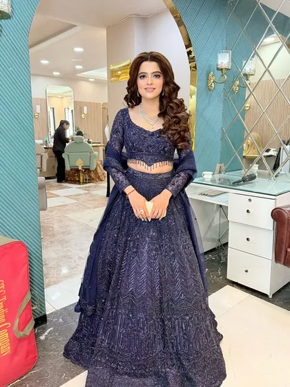 A full-length shot showing the beautiful flare of her blue lehenga. The entire look is fit for a queen.