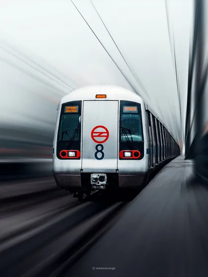 Delhi is my muse, and the Delhi Metro is its lifeline. I used a slow shutter speed to create this motion blur effect, capturing the speed and energy of the city. This image demonstrates my ability to find dynamic, artistic perspectives in everyday urban scenes for powerful brand storytelling.