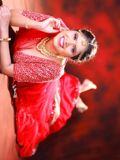A playful, reclining pose on a reflective floor. The angle is unconventional and adds a unique touch to the series.