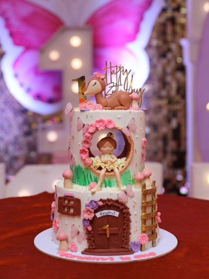The fairyland cake in its party setting, looking absolutely magical under the lights.