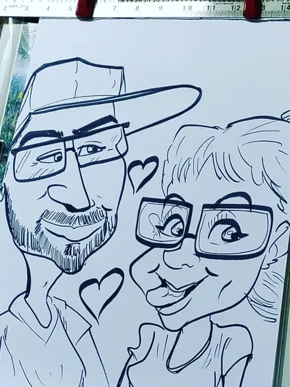 Hearts and smiles all around in this lovely couple's caricature. It’s a great example of a romantic and funny gift.