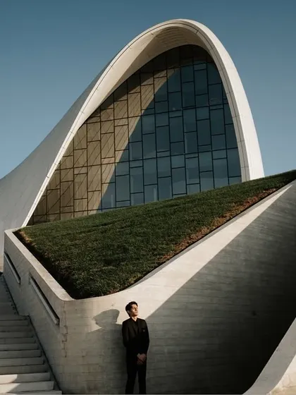 Another perspective of the incredible architecture in Baku. The couple is positioned on different levels of the structure, adding depth and a sense of grandeur to their destination photoshoot.