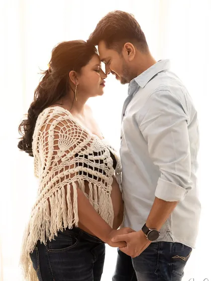 An intimate moment between expecting parents during a bright, high-key studio session. I love capturing that quiet connection and excitement before the baby arrives.
