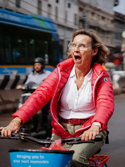 The pure, unfiltered joy of exploring a new city on a bicycle. This rider's expression of surprise and delight is why we love what we do.