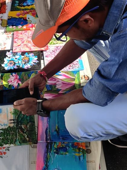 My collection of tiny paintings spread out at Chitra Santhe, attracting art admirers of all ages. These small canvases are a great way to start your art collection.