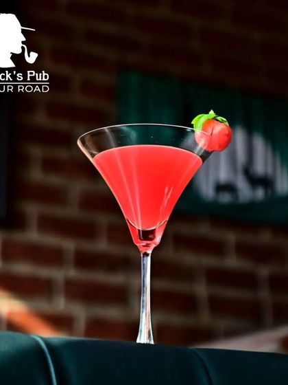 A classic cosmopolitan-style cocktail, presented simply to let the vibrant color and flavor shine. It's a popular choice for those who enjoy a timeless, fruity drink.