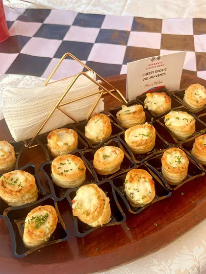 Cheesy Exotic Vol-au-vents on a serving tray, perfect for a high-tea or cocktail event.