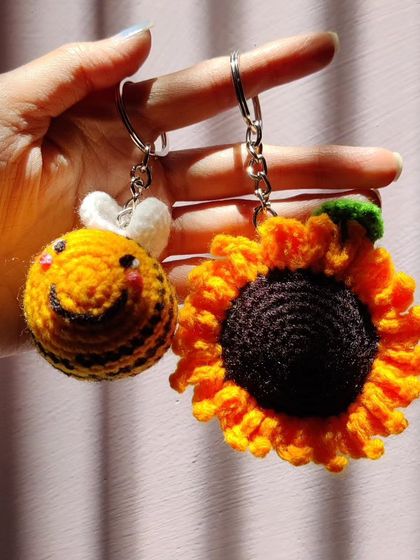 My super popular bumblebee keychains. They come in the classic yellow and black, but I also make them in fun colors like pink, blue, and purple.