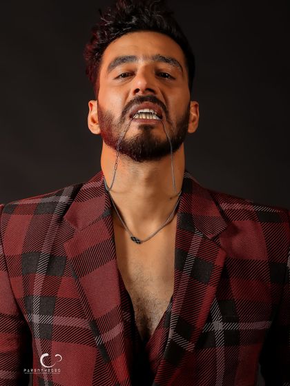 A raw and edgy pose that breaks from convention. This shot captures a moment of untamed energy and attitude.