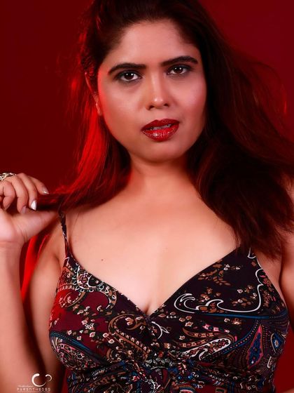 A close-up shot that feels intimate and engaging. The focus is on her expression and the story in her eyes.