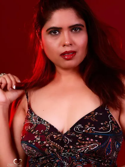 A close-up shot that feels intimate and engaging. The focus is on her expression and the story in her eyes.