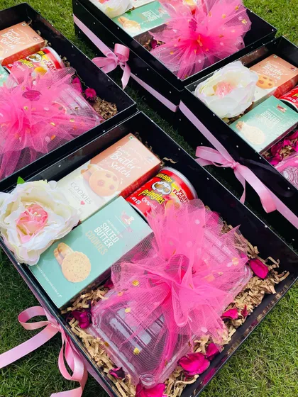 I can prepare large orders of custom Diwali hampers for pan-India shipping. Here, multiple boxes are ready to be sent out, each consistently packed with goodies and festive cheer.