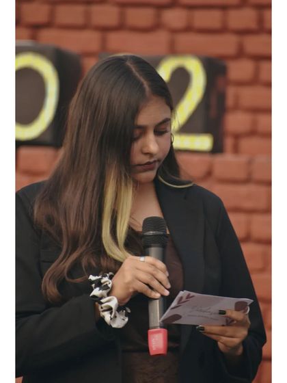 A moment of focus, going over my notes before the next segment. Being prepared is key, even when the event is all about spontaneous fun.