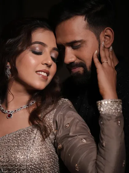 An intimate couple shot from their engagement. The bride's shimmering eye makeup catches the light beautifully.