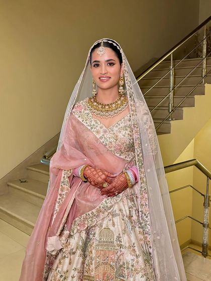 A full-length shot of Saloni, showing how the makeup, hair, and outfit create a cohesive and breathtaking bridal look.