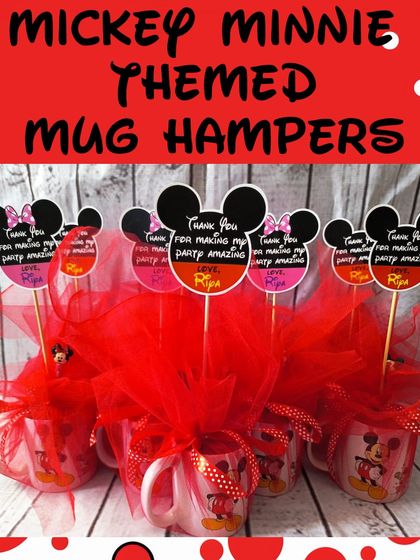 A group of the Mickey and Minnie themed mug hampers, all wrapped and ready for a party. The custom tags add a personal touch.