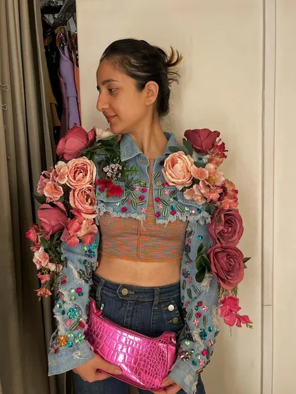 This piece explores the idea of organic fashion. I transformed a simple cropped denim jacket by adding intricate beadwork and sculptural, three-dimensional floral arrangements to the sleeves and shoulders.