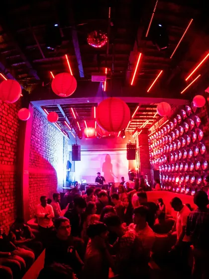 The red-lit interior of Roxy, packed with people. The vibe is always intimate and intense.