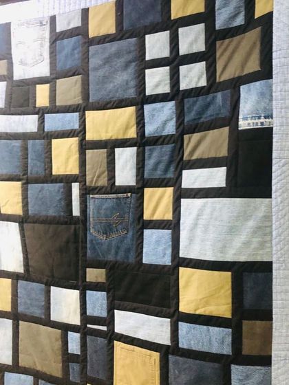 Another angle of the denim and T-shirt quilt, highlighting the different textures of the fabrics.