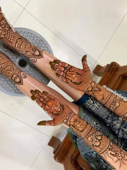 A beautiful portrait of Radha and Krishna, symbolizing divine love. This design is perfect for brides who want to incorporate spiritual elements into their mehndi.