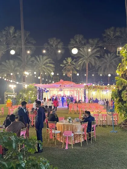 A wide-angle view of a large outdoor reception, showing the guest seating, food stations, and stage area. This highlights my capability in planning and managing large-scale events.