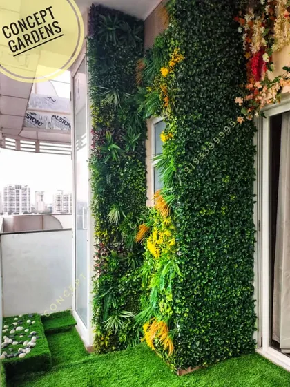 This high-rise apartment balcony is now a private urban oasis. We installed dense vertical green walls for privacy and visual appeal, complemented by durable artificial turf flooring, turning a standard balcony into a beautiful and functional outdoor living area.