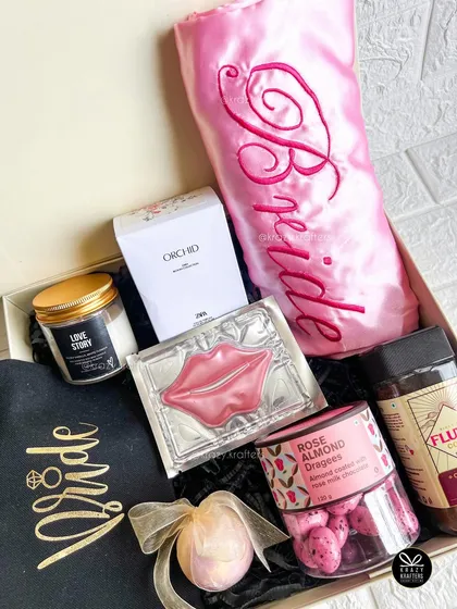 Another view of the bride-to-be hamper, showing the arrangement of the personalized robe, perfume, and gourmet treats.