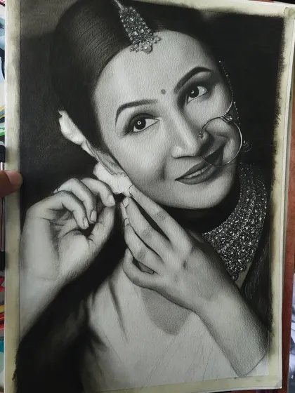 The completed portrait is held up, showing the incredible detail achieved with graphite and charcoal. The contrast between the dark background and the bright details makes the piece stand out.