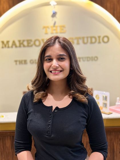 A happy client showing off her fresh balayage. The soft waves and beautiful blend of colors give her that perfect salon-finished look.