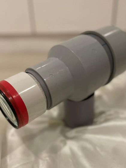 A duplicate of the handmade PVC pipe camera, highlighting its clever construction and the potential for creating art from simple materials.