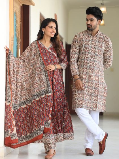 A closer look at the intricate red and black block print on this matching couple's outfit. The 100% cotton fabric is soft and breathable.