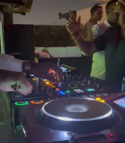 Another angle of me working the mixer. Precision and timing are key to creating a smooth and engaging set.