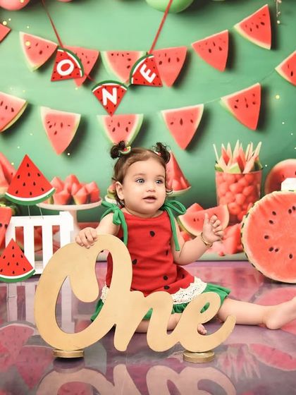 A sweet and juicy watermelon theme for a "one in a melon" first birthday. The bright colors and fun props make for a vibrant and memorable celebration.