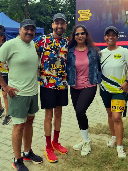 Our team members posing with a participant who just finished his race. We are there to support every runner at the finish line.