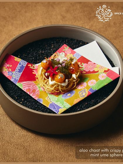 Aloo chaat with crispy potatoes and mint ume sphere, a signature from Spice Lab Tokyo featured in our collaborative menu.
