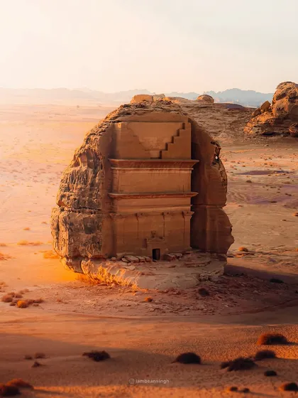The 'Lonely Castle' or Qasr al-Farid in Hegra, Saudi Arabia. This ancient tomb, carved into a single massive boulder, stands alone in the desert, and I captured it during the golden hour to highlight its majesty.