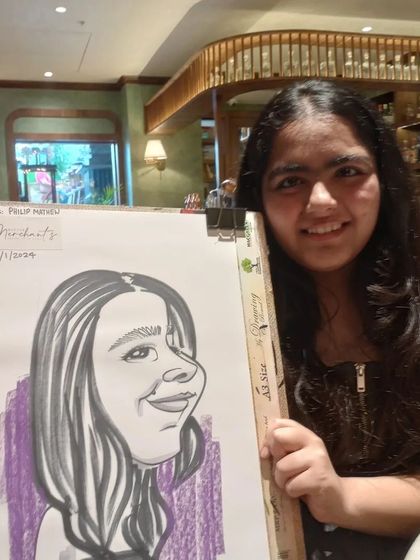 A young guest from the same event, happy with her new portrait.